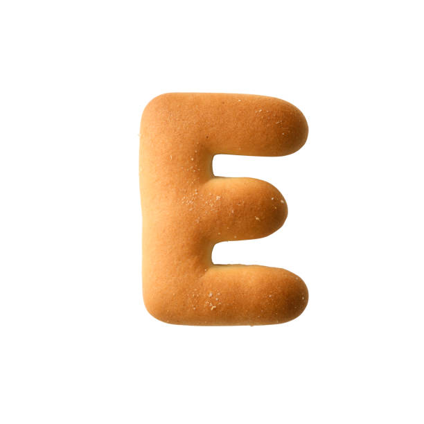 istock Isolated shot of uppercase alphabet biscuit E on white background 1324975450