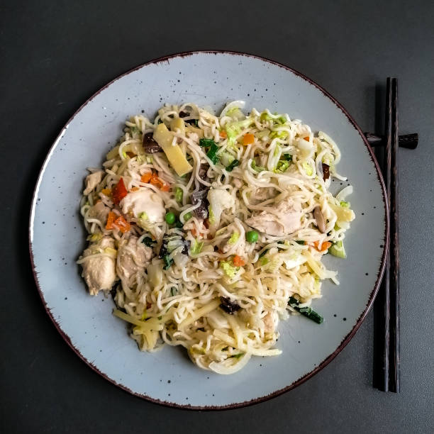 istock Fried Chinese pasta with vegetables and meat 1324978164