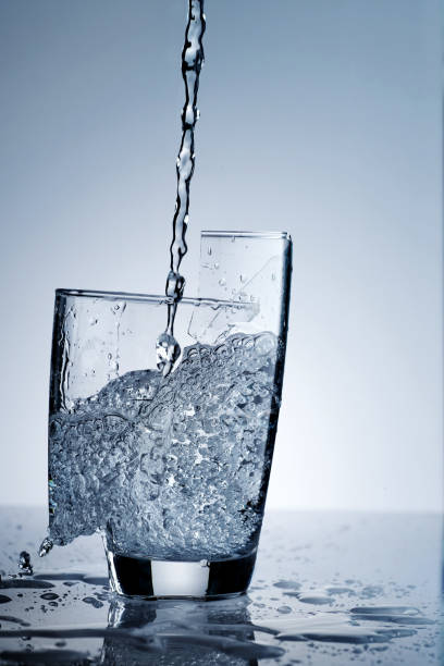 pouring fresh drinking water in hard way that made a glass broken and some part falling down