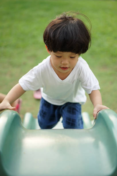 istock Happy little Asian boy in playground 1324981556