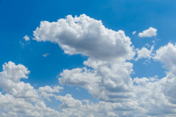 istock Blue clear sky with white fluffy clouds. Natural background 1324983813