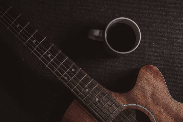 istock Close-Up Brown acoustic guitar in low light 1324987625