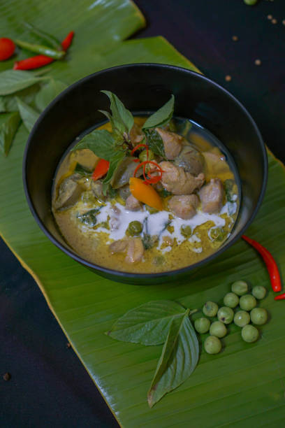 istock Green Curry With Chicken in bowl on banana leaf 1324988538