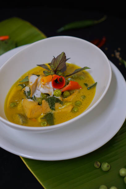 istock Green Curry With Chicken in bowl on banana leaf 1324988559