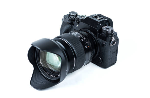 istock Vintage looking modern mirrorless camera isolated on white background 1324993573