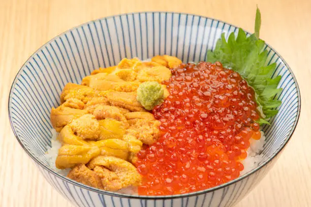 Uni ikura rice bowl. Sea urchin and salmon roe bowl.