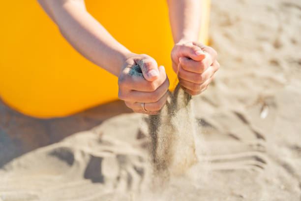 istock playing with sand at sea beach 1324996857