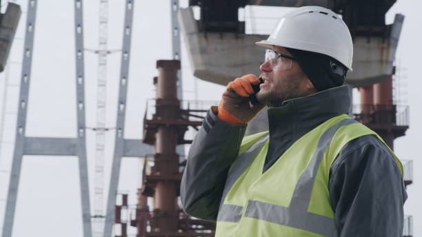 istock Male engineer examining bridge and speaking on cellphone 1324997520