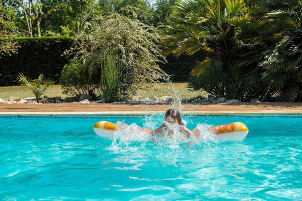istock cute young girl playing on her inflatable buoy 1324998888