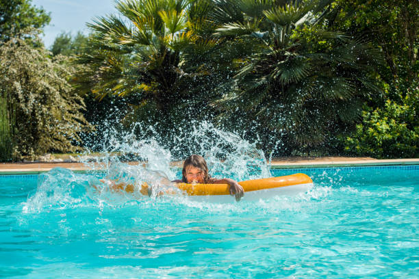 istock cute young girl playing on her inflatable buoy 1324998930