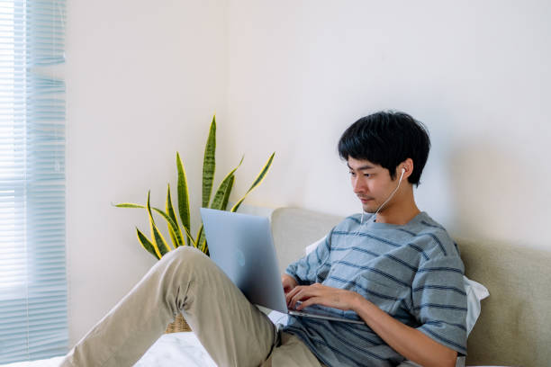 istock Man freelancer working at apartment balcony in the morning. 1324998992
