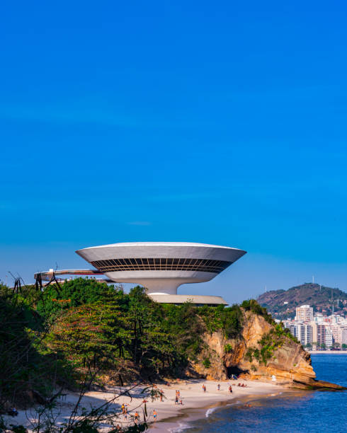The Museum of Contemporary Art in Niterói designed by Oscar Niemeyer The Museum of Contemporary Art of Niterói (MAC) was designed by Oscar Niemeyer, a very important Brazilian architect. In 2020, the Museum of Contemporary Art was elected, by the Project Management Institute (PMI), as one of the 10 most influential works of architecture in the last 50 years. rio parana stock pictures, royalty-free photos & images
