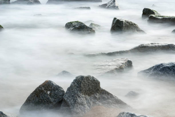 istock Ocean Mist Seascape of Water Rushing through Rocks 1325003418