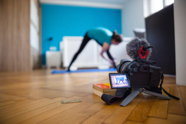 Camera with digital display recording vlog on home exercise