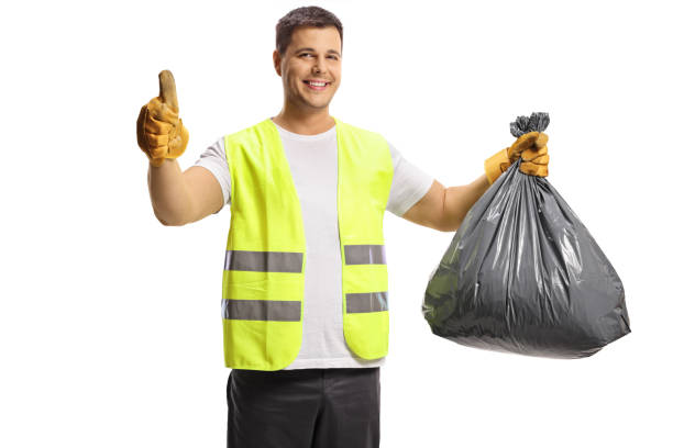 istock Waste collector holding a black plastic bin bag and showing thumbs up 1325007098