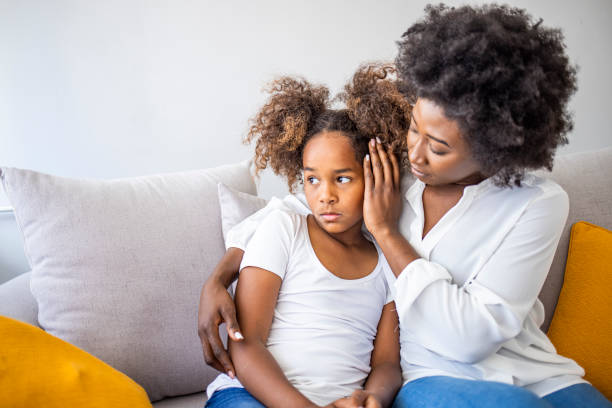 istock Focus on upset sad small daughter sitting on sofa with mother 1325009608