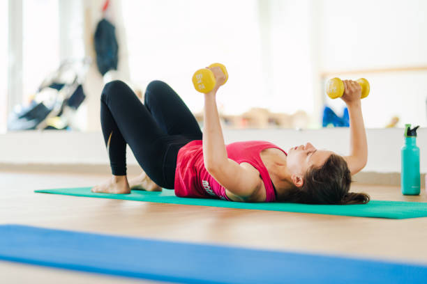 istock Young woman training in fitness studio. 1325009656