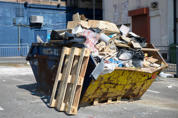 istock Dumpster full of trash and building waste in an empty car park 1325010401