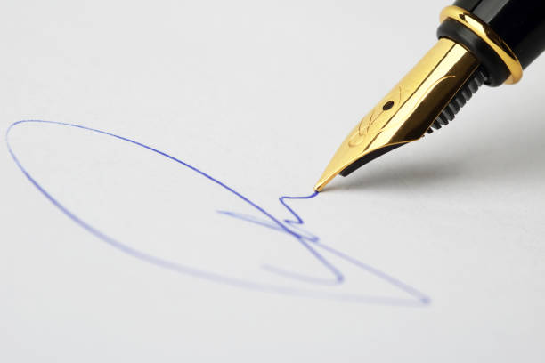 close up of fountain pen and signature. - contract signing document legal system imagens e fotografias de stock