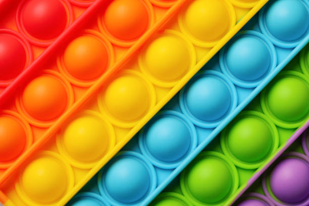 istock Rainbow pop it fidget toy as background, closeup 1325013943