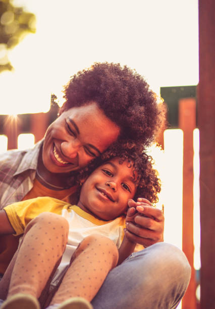 istock Mother and daughter on playground. 1325016363