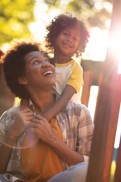 istock Mother and daughter on playground. 1325016541