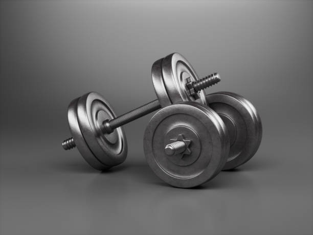 istock Metal dumbbells on dark background 1325017519