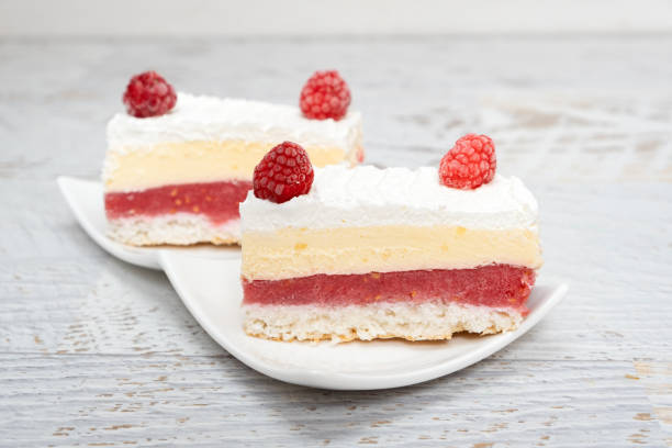 istock Piece of vanilla slice cake, and raspberries 1325018504