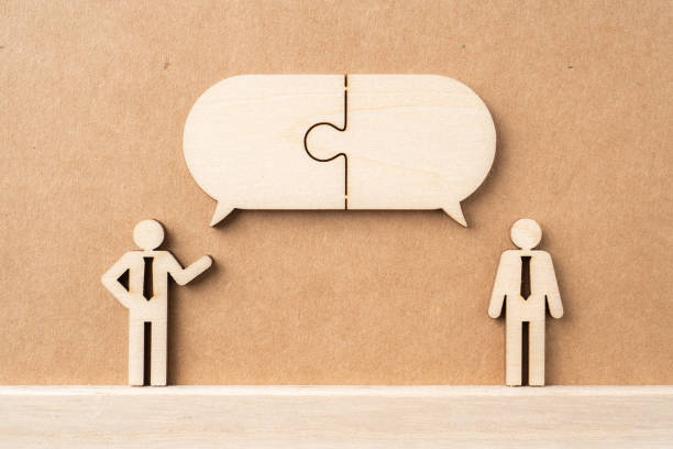istock wooden businessman with conversation concept 1325020288