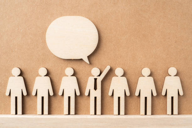 istock wooden businessman with conversation concept 1325020314