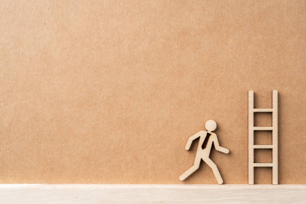 istock wooden businessman with leadership concept 1325021707