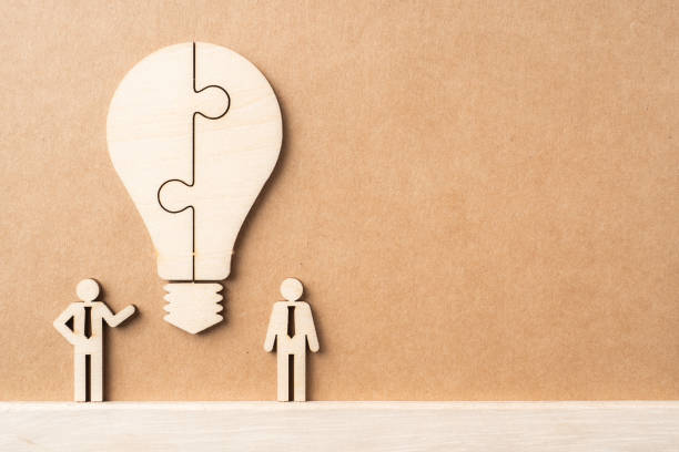 istock wooden businessman and light bulb, idea concept 1325021815