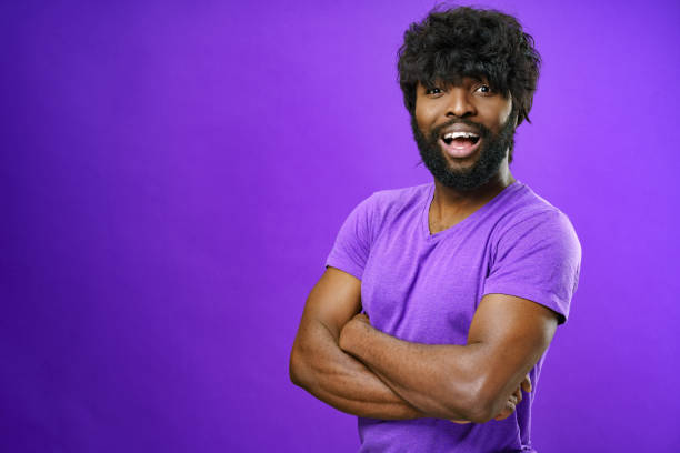 istock Portrait of smiling young black man in studio 1325022839