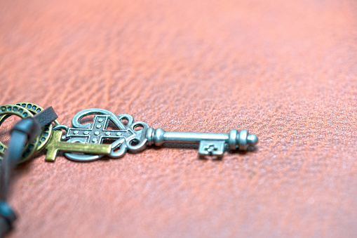 cross and key on the leather background for inspiration with cross