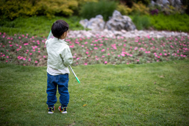 Asian boy playing in the park