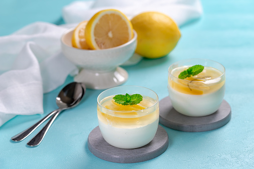 Lemon mousse in crystal bowl with lemon jelly topping and mint