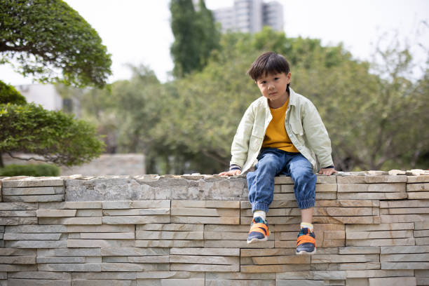 Asian boy playing in the park