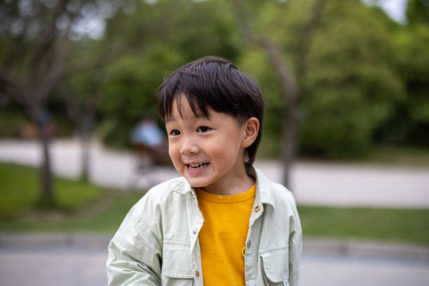 istock Asian boy playing in the park 1325029252