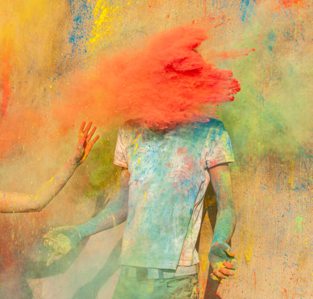 istock Throwing colourful powder at people 1325029820