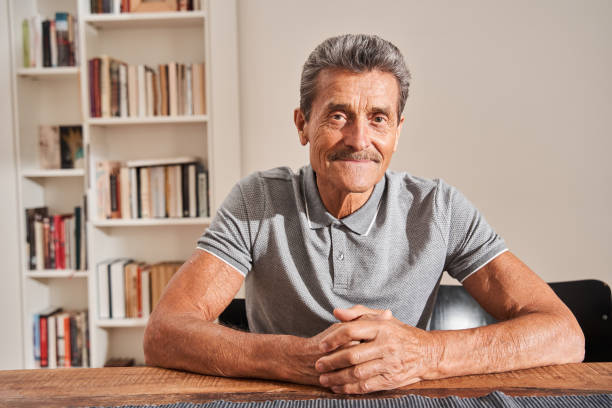 istock Man looking attentively to the camera with pleasure smile 1325030091