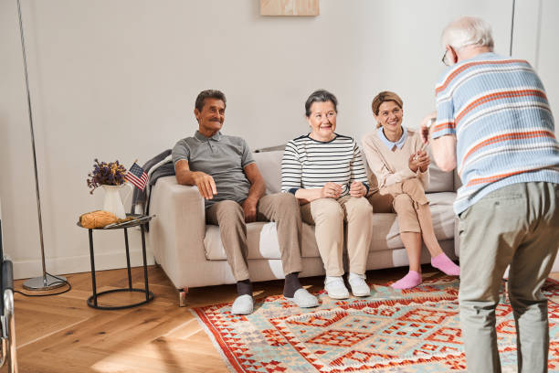 istock Old man who shoving pantomime while playing at the leisure game 1325030184