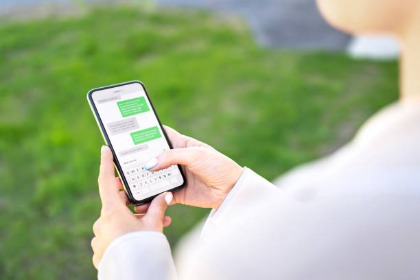 istock Woman texting with phone outdoors. Text message with smartphone. Digital sms and instant messaging chat. Person using cellphone in park outside in summer. 1325031215