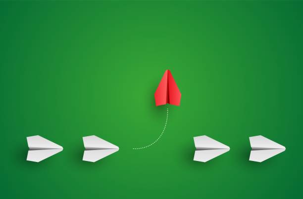 istock Individuality concept. Individual and unique leader red paper plane flies to the side. Think different 1325031250