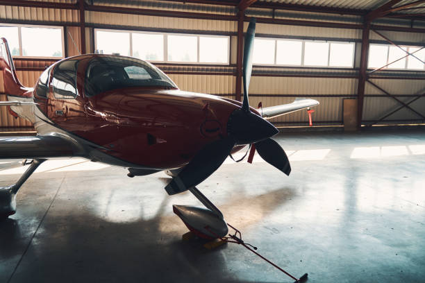 istock Airport parking building with modern light aircraft 1325031587