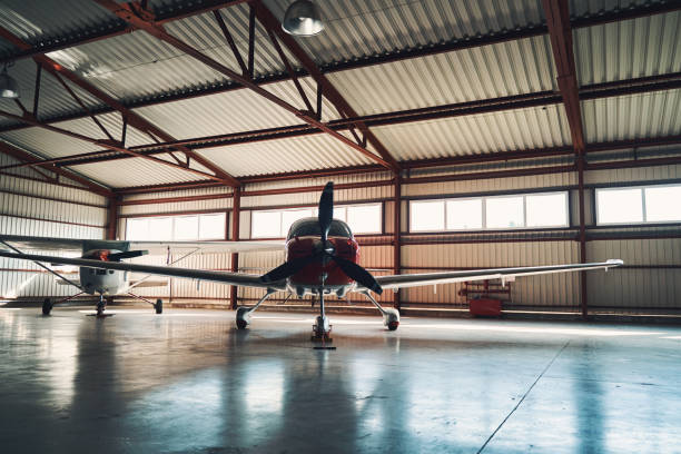 istock Airport parking building with two light aircrafts 1325031598