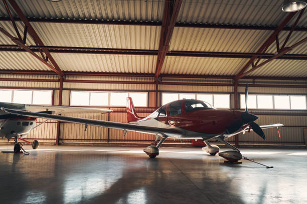 istock Airport parking building with two small airplanes 1325031817