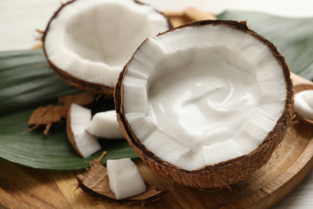 istock Ripe coconut with cream on wooden board 1325032616