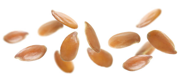 istock Many linseeds falling on white background, banner design. Vegan diet 1325032873