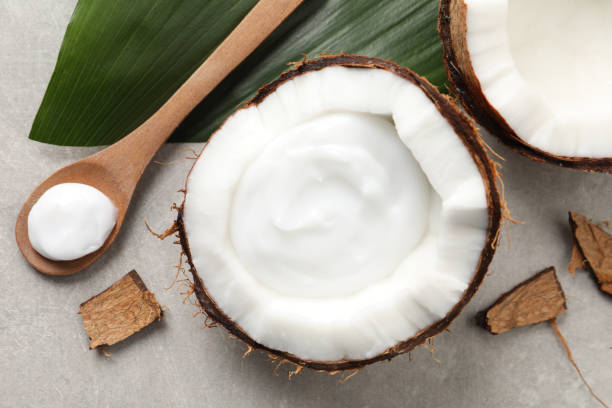 istock Ripe coconut and cream on light grey table, flat lay 1325032983