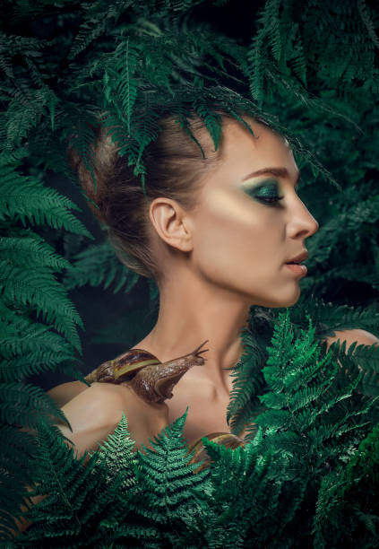 istock Mother Nature figure with snails 1325033490